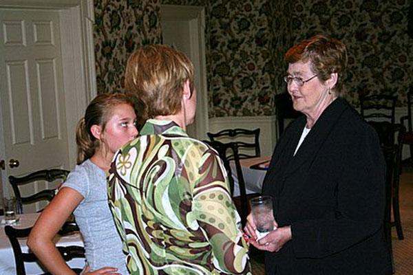 a group of women talking to each other