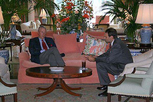 men sitting on a couch in a room