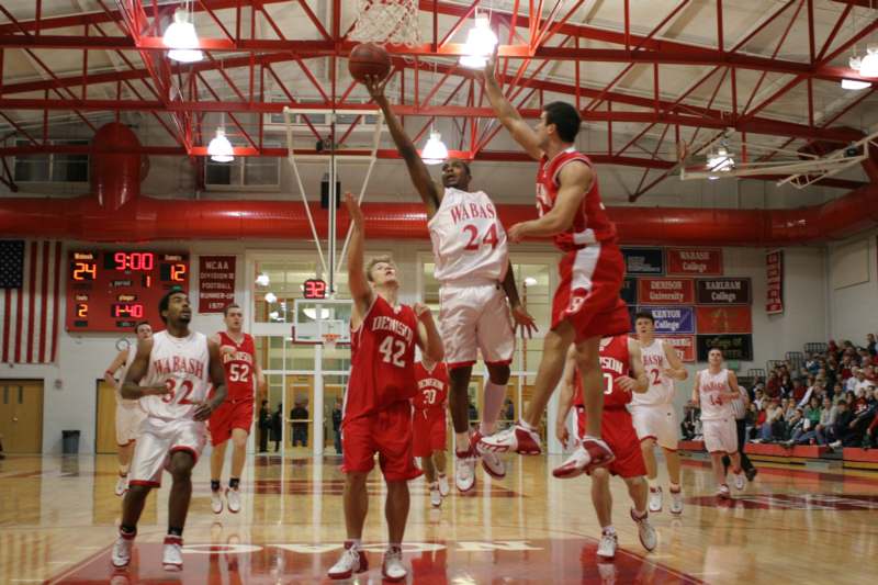 a group of men playing basketball