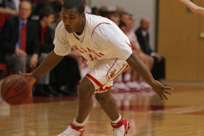 a basketball player in a white uniform
