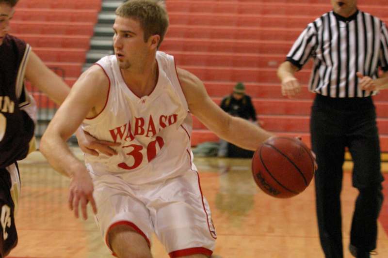 a basketball player dribbling a ball