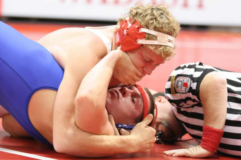 a man wrestling on the floor