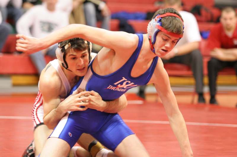 a man in a wrestling uniform