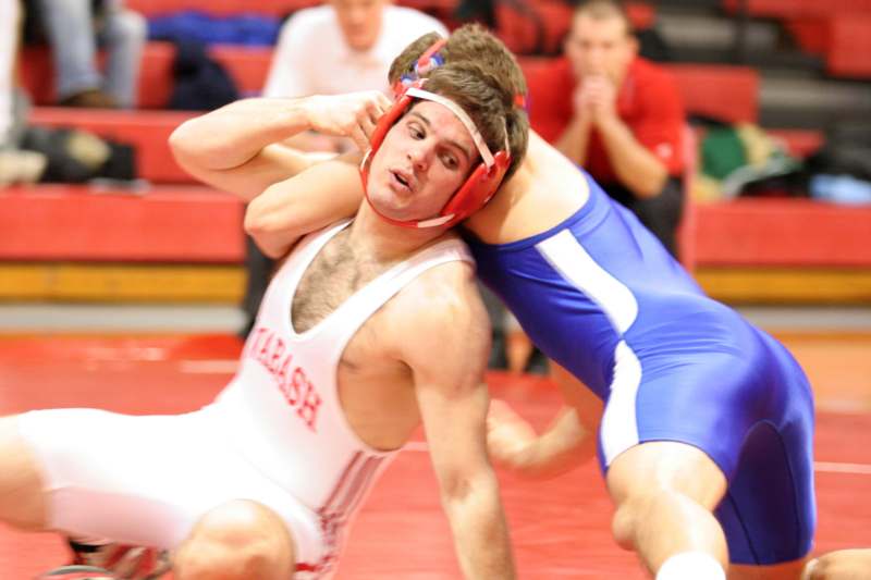 a man wrestling another man in a wrestling match