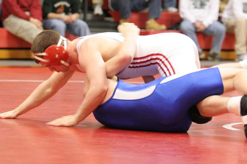 a man wrestling on the floor