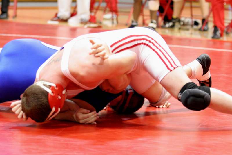 a man wrestling on the floor