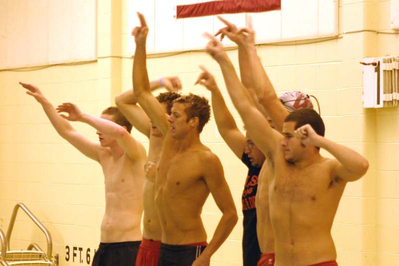 a group of men raising their hands