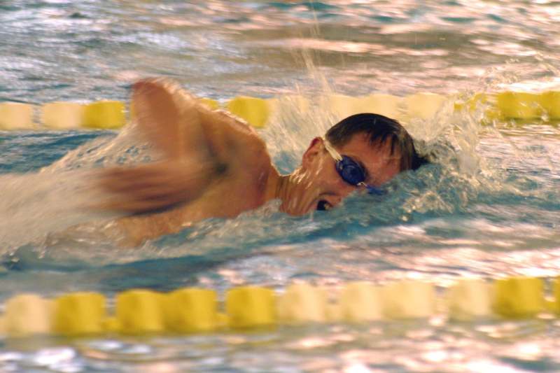 a man swimming in a pool
