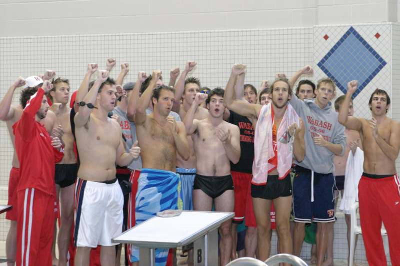 a group of men in swim trunks
