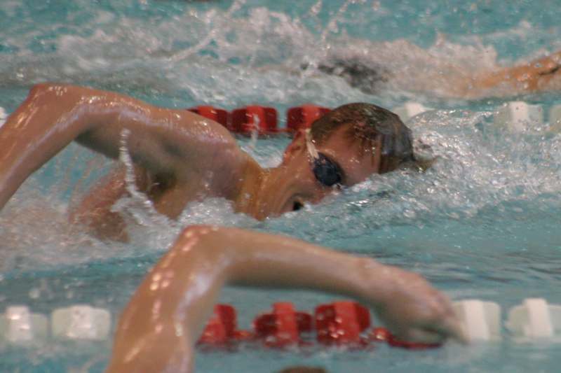 a man swimming in a pool