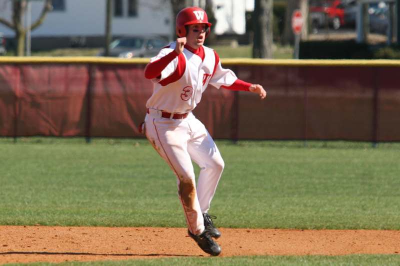 a baseball player running to first base