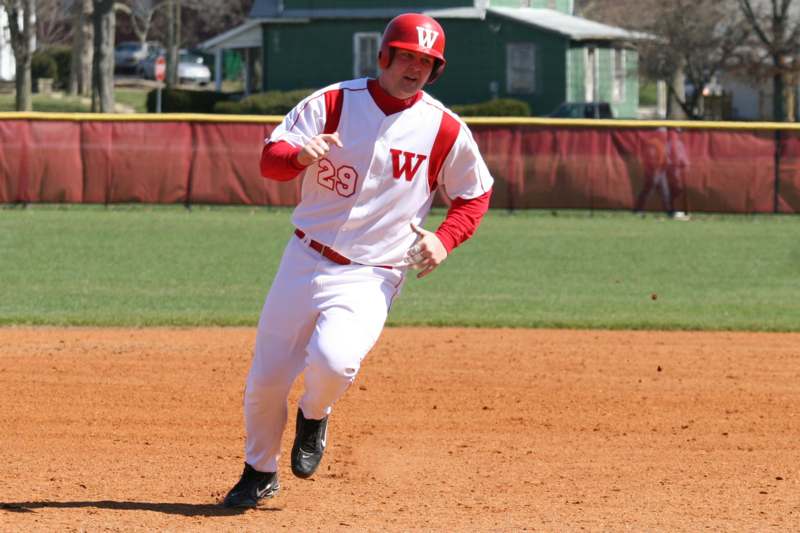 a man running on a baseball field