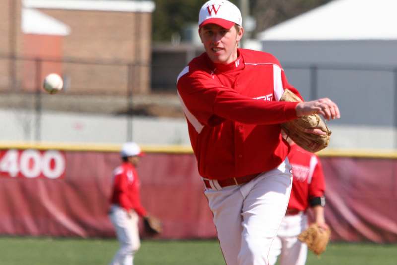 a baseball player throwing a ball