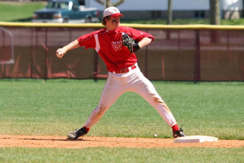 a baseball player throwing a ball