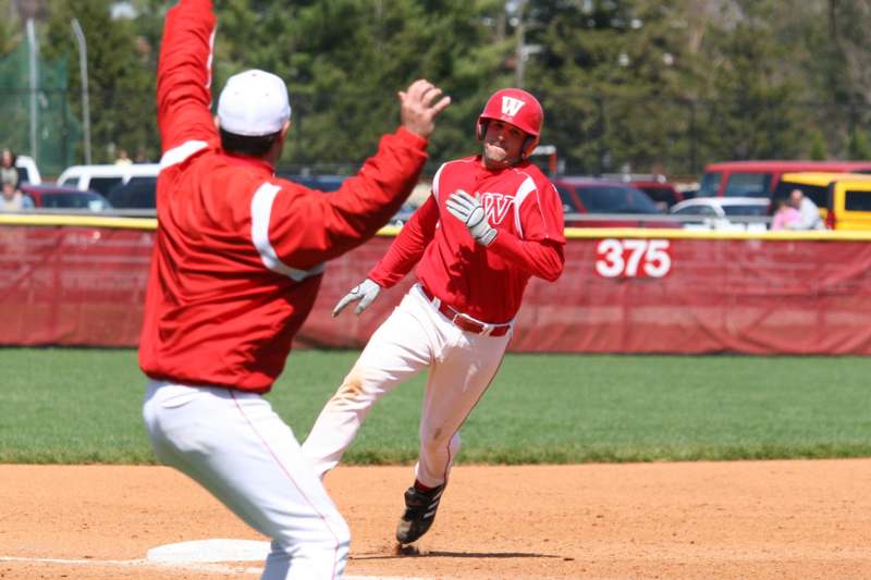 a baseball player running to first base