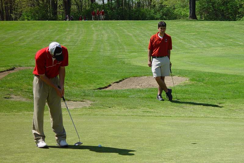 a man playing golf on a golf course
