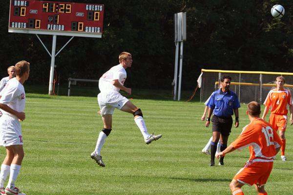 a football player kicking a ball