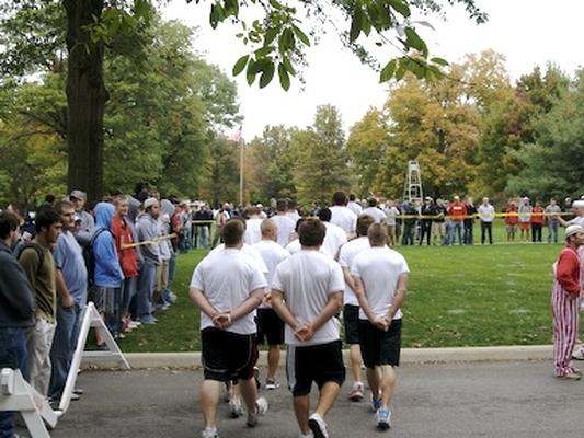 a group of people in white shirts