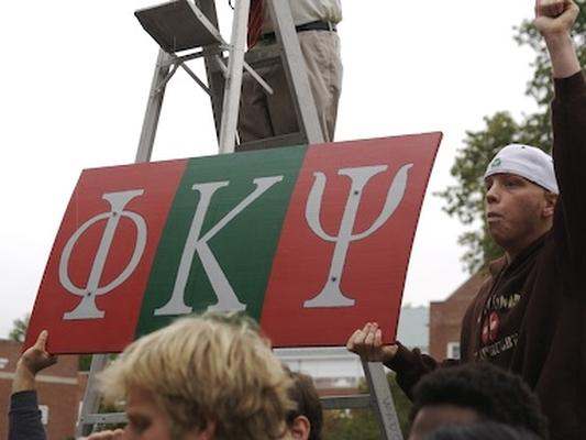 a man holding a sign