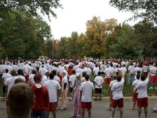 a large group of people in white shirts