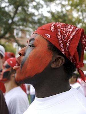 a man with red face paint