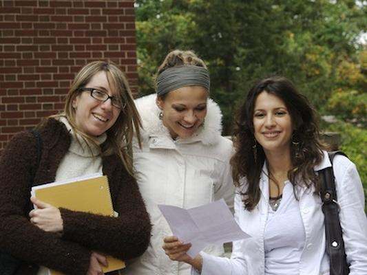 a group of women standing outside
