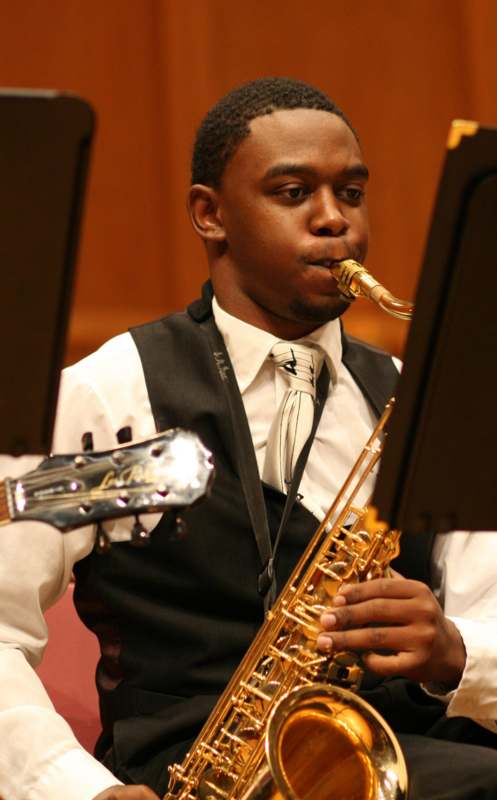 a man playing a saxophone