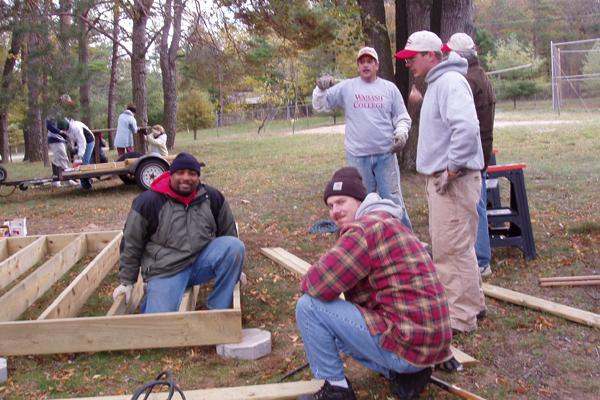 a group of men building a house