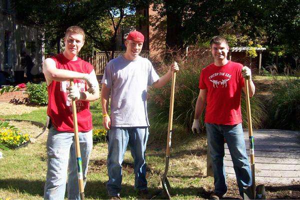 a group of men holding shovels
