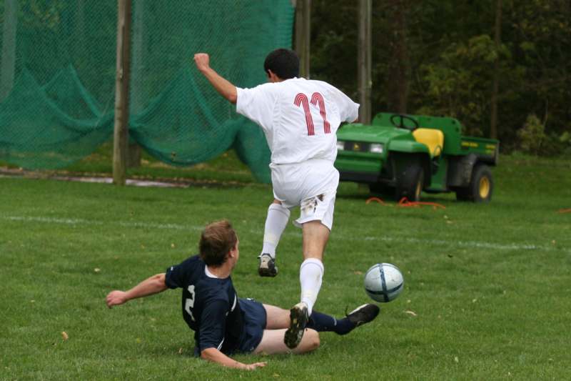 a football player kicking a football ball