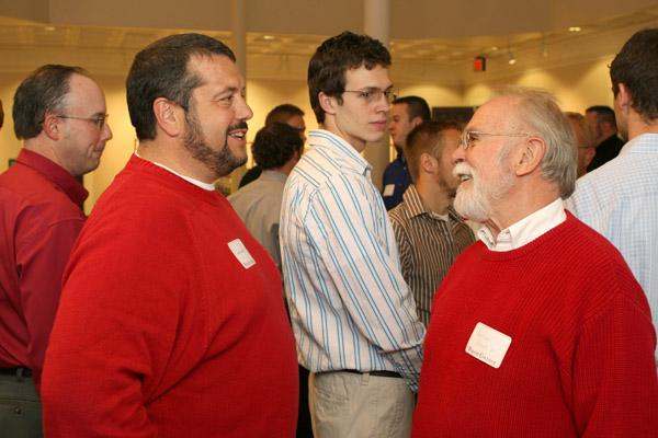 a group of men in red sweaters