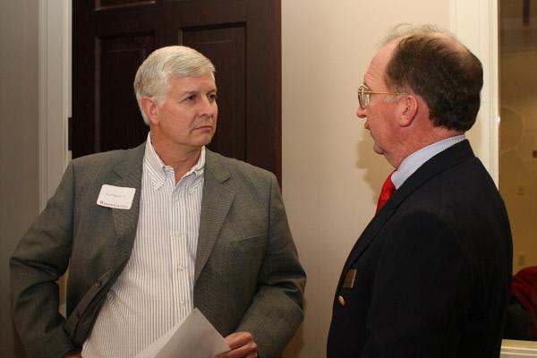 a man talking to another man