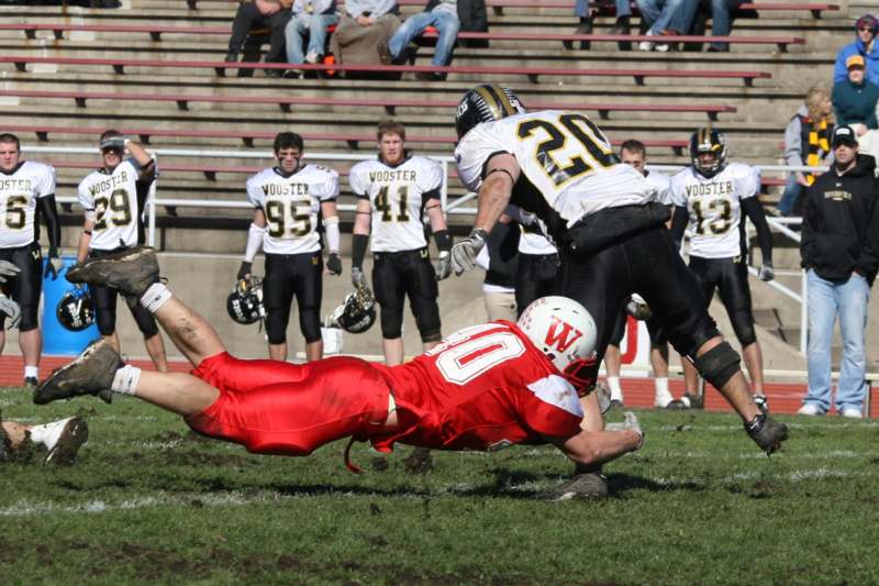 a football player diving for a ball