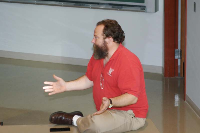 a man sitting on the floor with his feet up