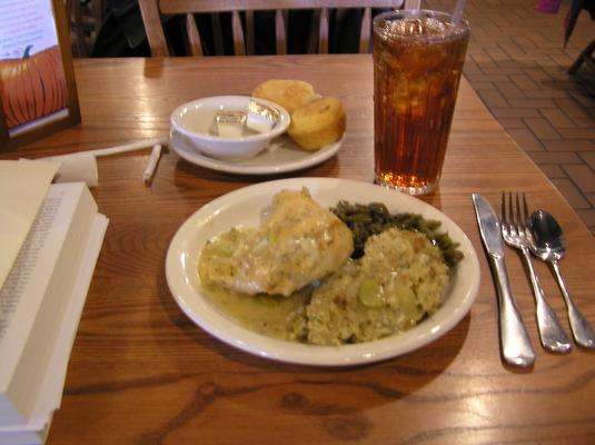 a plate of food and a drink on a table