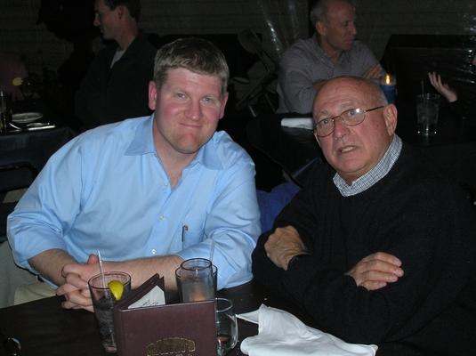 a couple of men sitting at a table