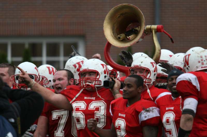 a group of football players with a trumpet
