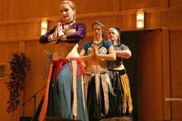 a group of women performing belly dance
