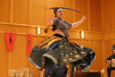 a woman in a garment dancing