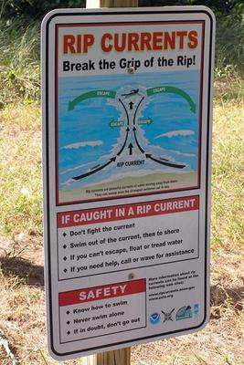 a sign with text and pictures on it