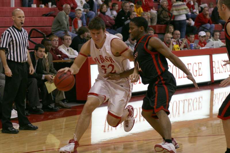 a basketball player dribbling a ball