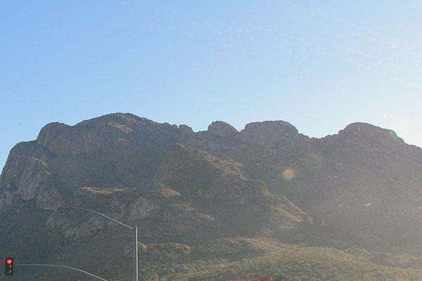 a mountain with a blue sky
