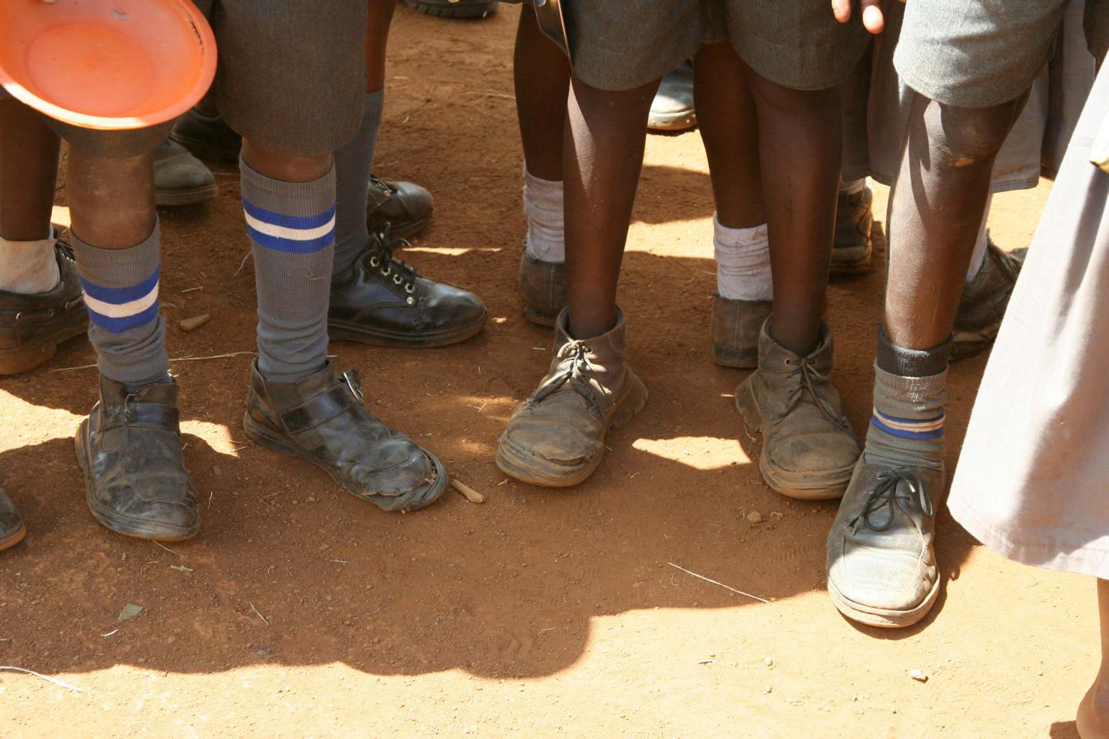 a group of children wearing shoes