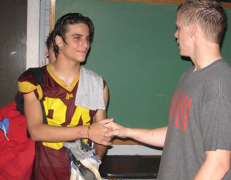 a man shaking hands with another man