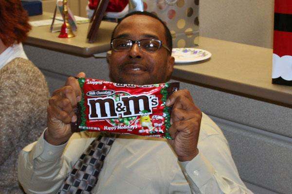 a man holding a candy bar