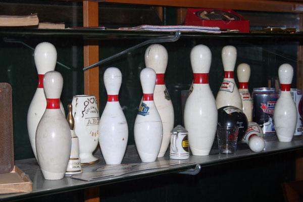 a group of bowling pins on a shelf