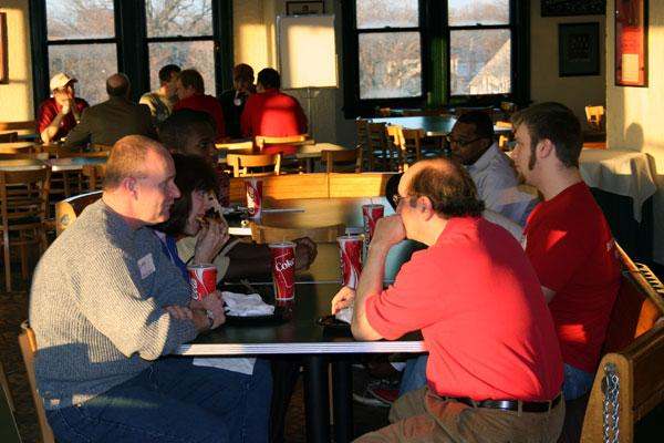 a group of people sitting at a table