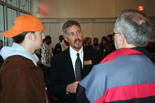 a man talking to a group of people
