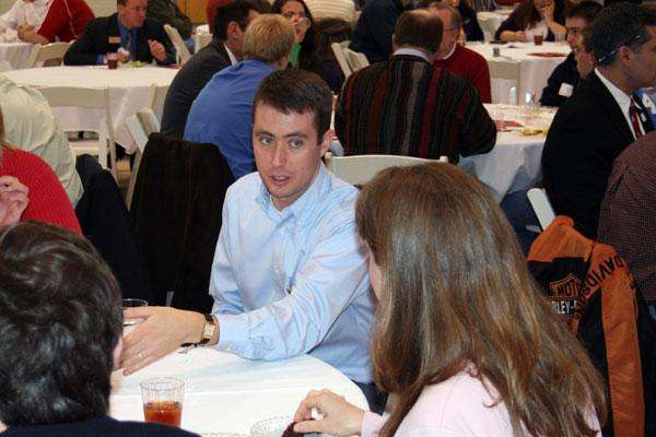a man sitting at a table with a woman