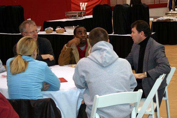 a group of people sitting around a table